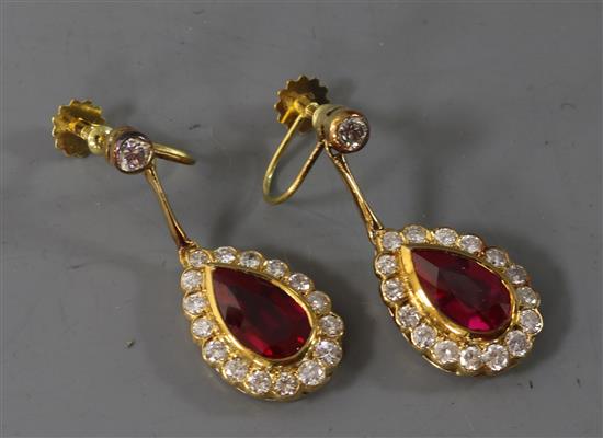 A pair of 18ct gold, synthetic ruby and diamond pear shaped drop earrings, 32mm.